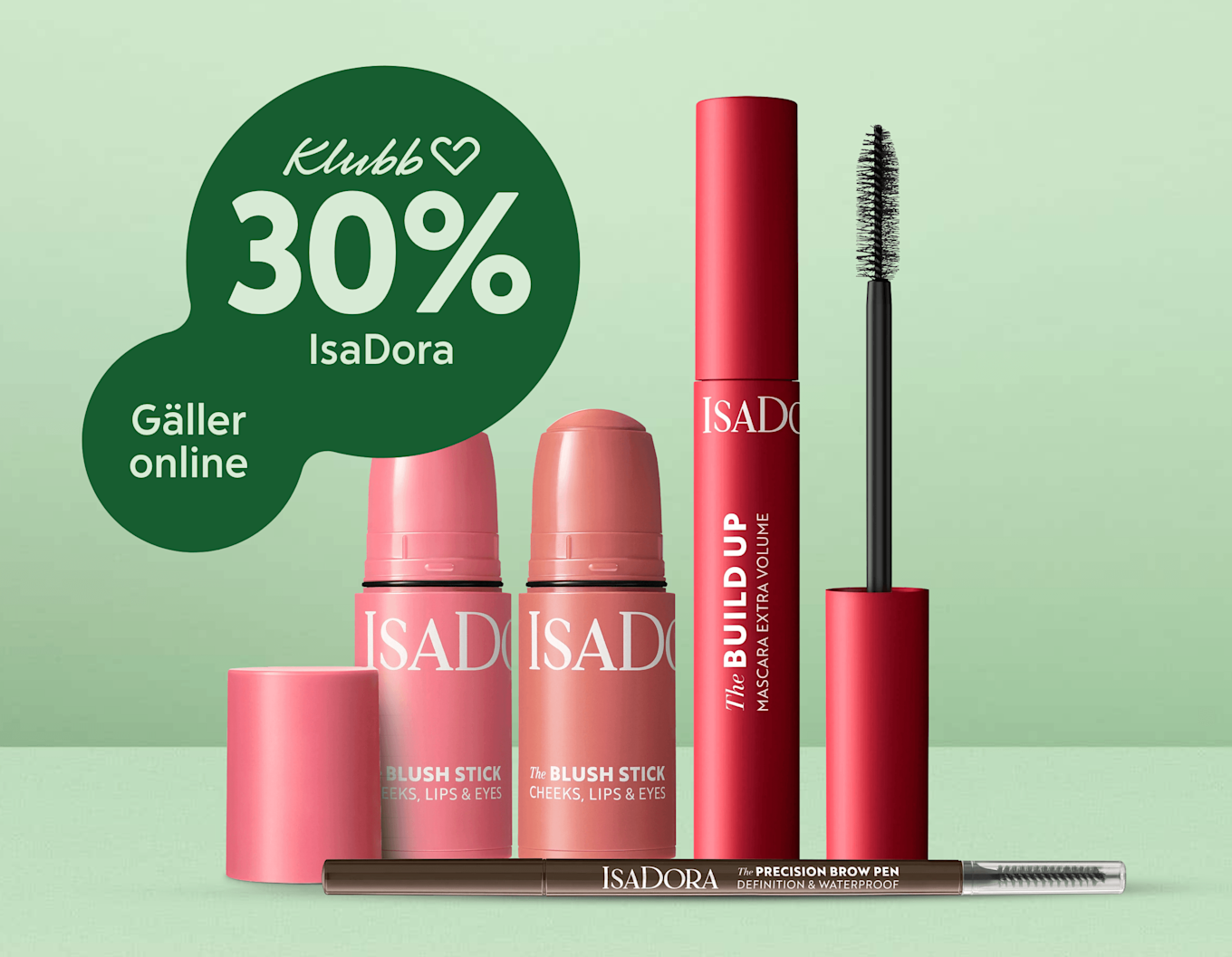 Gruppering av rosa och röd IsaDora-sminkprodukter stående mot mintgrön bakgrund med en mörkgrön cirkeltext som visar "Klubb 30% IsaDora".'
