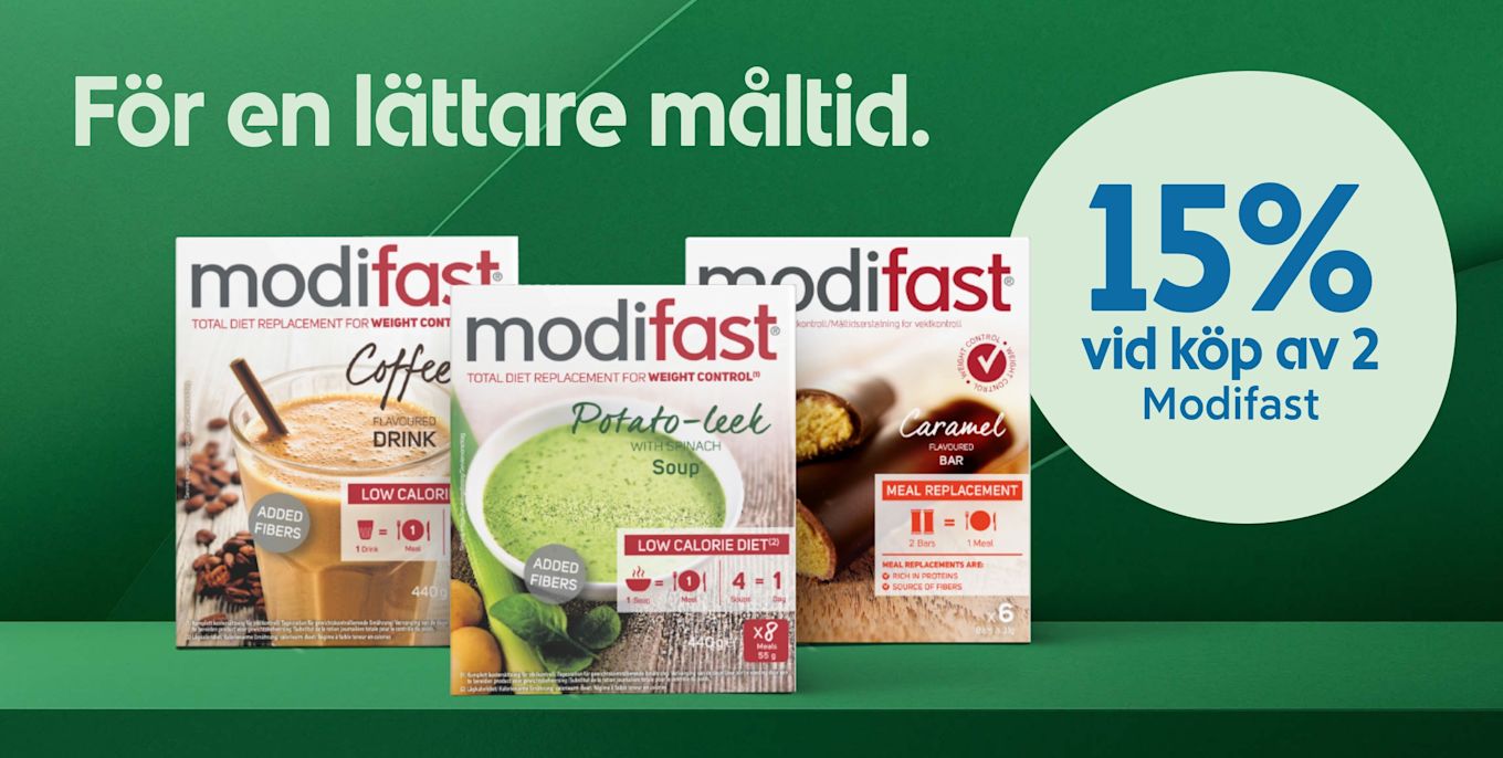 Tre Modifast-produkter med smakerna kaffe, potatis- och purjolökssoppa och karamell står på ett grönt bord med texten "För en lättare måltid" och erbjudandet "15% vid köp av 2 Modifast" på en grön bakgrund.